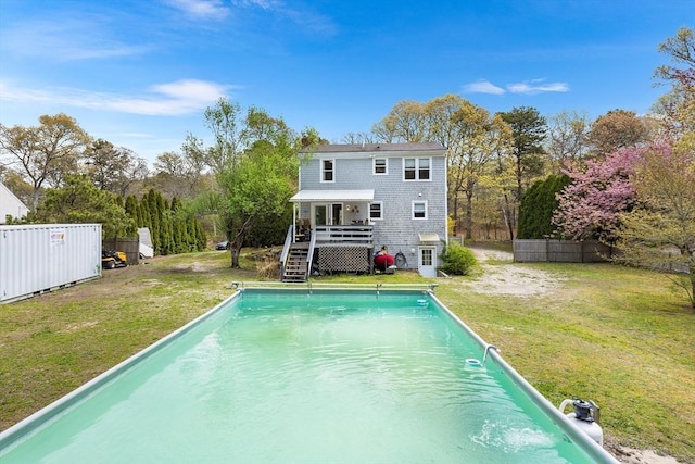 239 Upper County Rd, Dennis, MA 02660 - rear view of house with a deck, stairs, and an outdoor pool