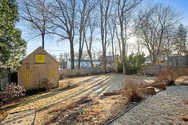 view of yard featuring an outbuilding and a fenced backyard