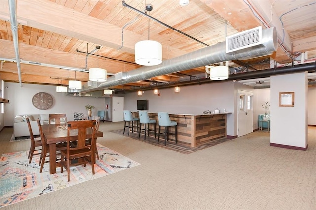 dining room with baseboards, visible vents, wooden ceiling, and carpet