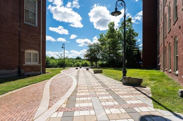 view of property's community with a yard