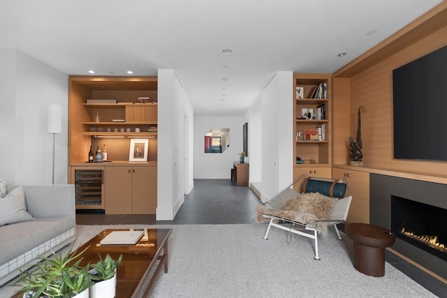 living room featuring wine cooler and bar