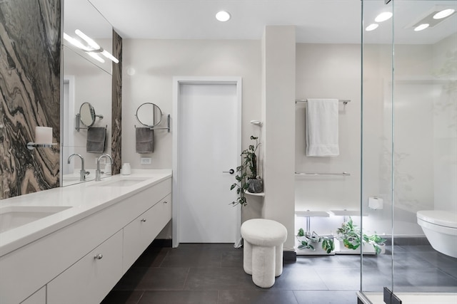 bathroom featuring vanity, toilet, an enclosed shower, and tile patterned floors