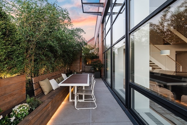 view of balcony at dusk