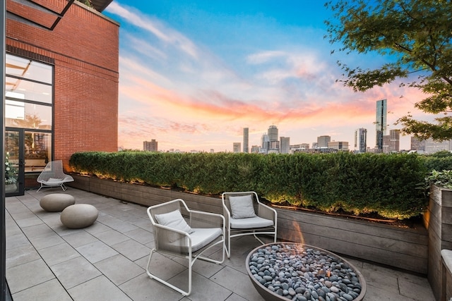 view of patio terrace at dusk