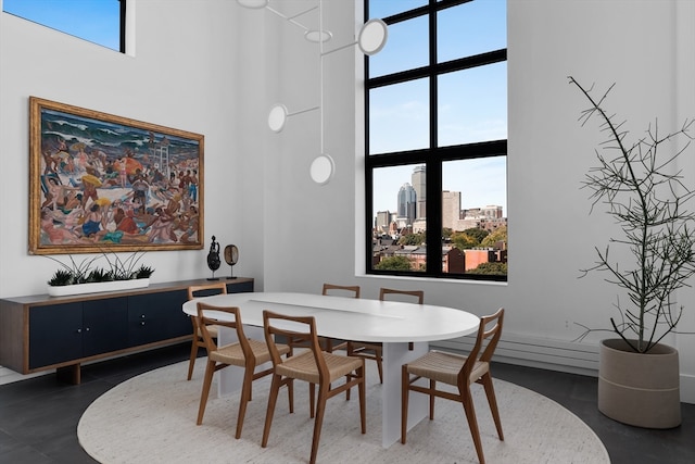 dining room with a high ceiling