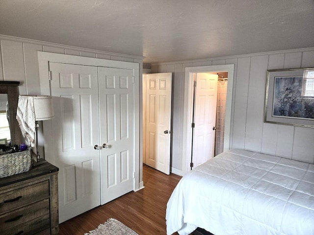 230 Gosnold St Unit 1A, Barnstable, MA 02601 - bedroom with a closet, dark wood finished floors, and a decorative wall