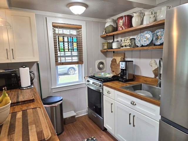 230 Gosnold St Unit 1A, Barnstable, MA 02601 - kitchen with stainless steel appliances, butcher block countertops, dark wood-style flooring, a sink, and plenty of natural light