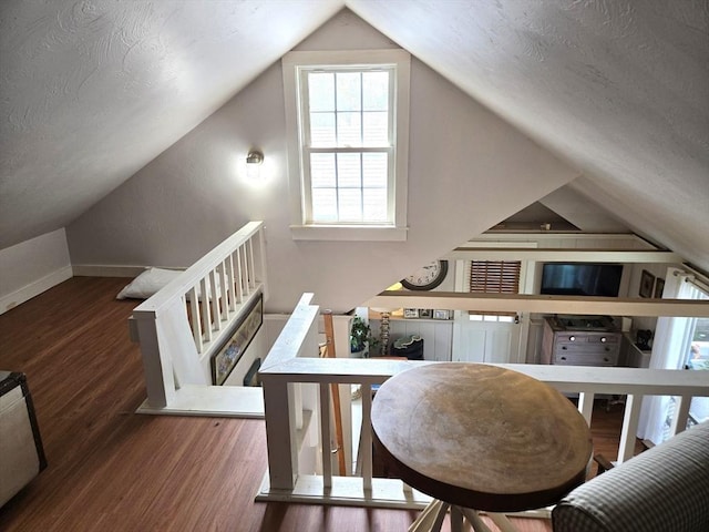 230 Gosnold St Unit 1A, Barnstable, MA 02601 - dining space featuring vaulted ceiling, wood finished floors, baseboards, and a textured ceiling