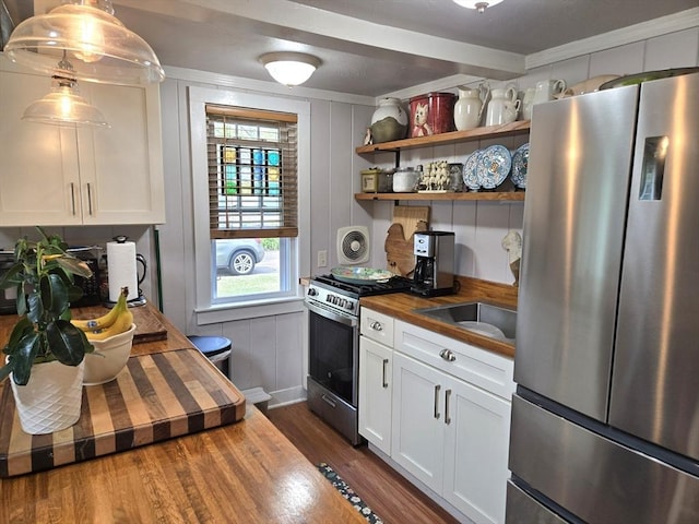 230 Gosnold St Unit 1A, Barnstable, MA 02601 - kitchen featuring appliances with stainless steel finishes, butcher block counters, dark wood finished floors, white cabinets, and a sink