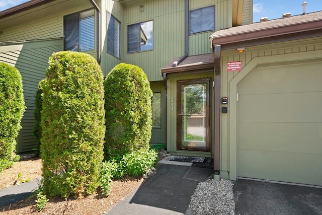 243 Trailside Way Unit 243, Ashland, MA 01721 - view of exterior entry with an attached garage