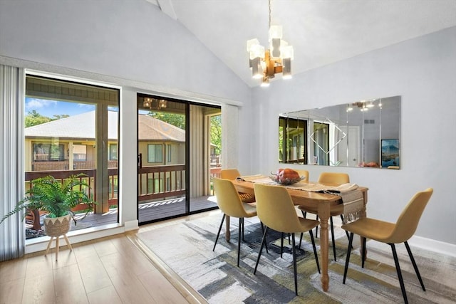 243 Trailside Way Unit 243, Ashland, MA 01721 - dining space with a chandelier, wood finished floors, high vaulted ceiling, and baseboards