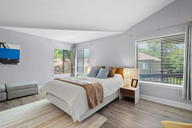243 Trailside Way Unit 243, Ashland, MA 01721 - bedroom featuring light wood-style floors, baseboards, and lofted ceiling