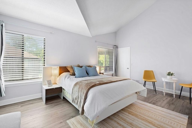 243 Trailside Way Unit 243, Ashland, MA 01721 - bedroom featuring wood finished floors, vaulted ceiling, and baseboards