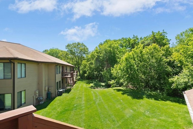 243 Trailside Way Unit 243, Ashland, MA 01721 - view of green lawn with a deck and stairway