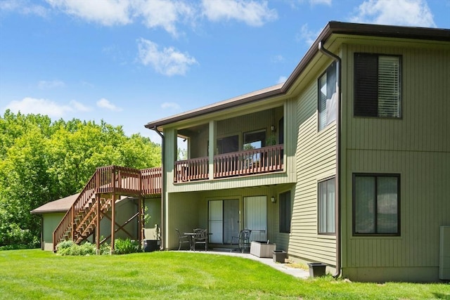 243 Trailside Way Unit 243, Ashland, MA 01721 - back of house featuring stairs and a lawn
