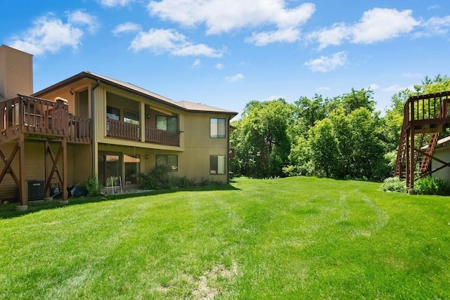 243 Trailside Way Unit 243, Ashland, MA 01721 - view of grassy yard with stairway and a wooden deck