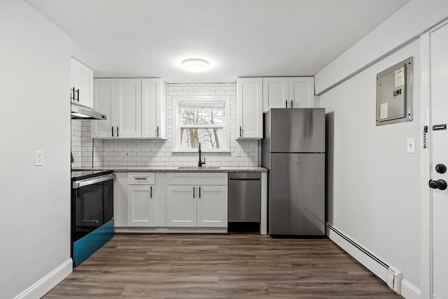 kitchen featuring a baseboard radiator, white cabinetry, appliances with stainless steel finishes, and sink