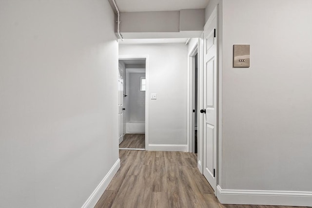 hallway featuring light hardwood / wood-style flooring