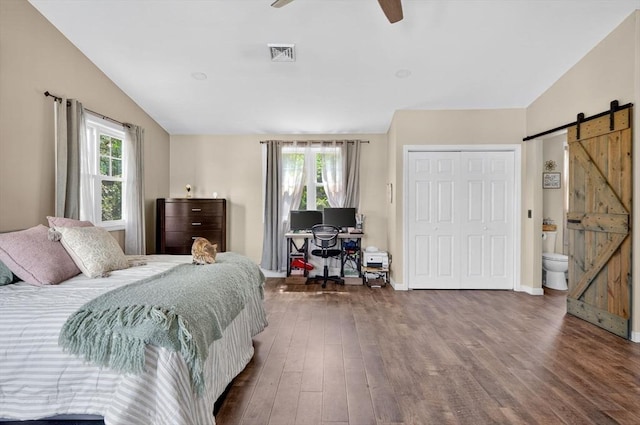 29 Edgemere Dr, Seekonk, MA 02771 - bedroom with a barn door, multiple windows, wood finished floors, lofted ceiling, and ceiling fan