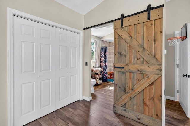 29 Edgemere Dr, Seekonk, MA 02771 - foyer with a barn door, dark wood-style flooring, and lofted ceiling