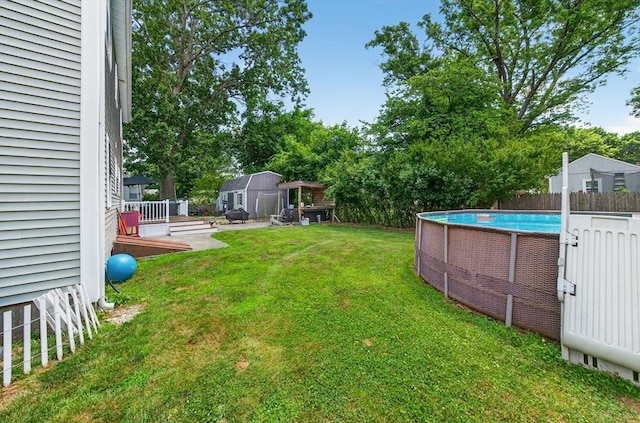 29 Edgemere Dr, Seekonk, MA 02771 - view of yard featuring an outdoor pool, a storage shed, and a deck