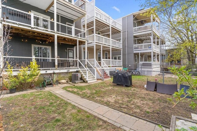 13 Maryland St Unit 2, Boston, MA 02125 - back of property with central AC unit and fence