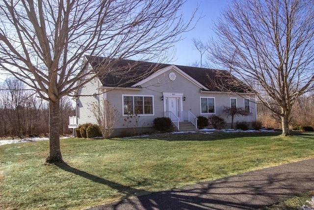 ranch-style house featuring a front lawn