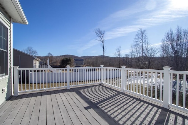 wooden terrace featuring a mountain view