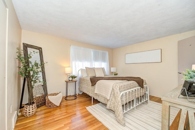 bedroom featuring light wood-type flooring