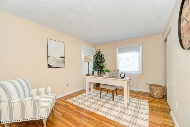 office space featuring light wood finished floors and baseboards