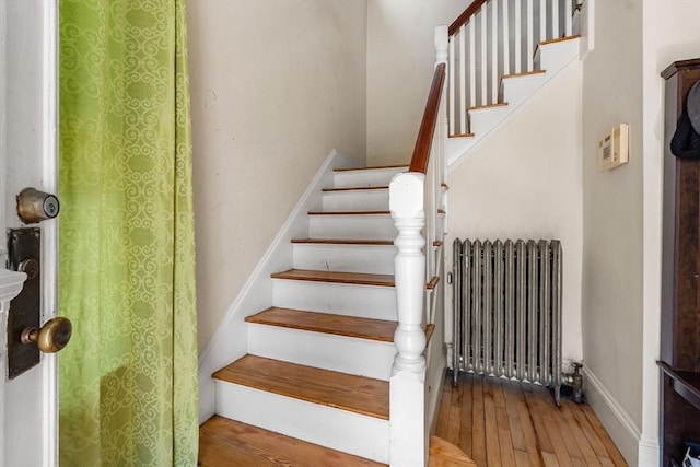 426 Moraine St, Brockton, MA 02301 - stairs featuring radiator heating unit and hardwood / wood-style flooring