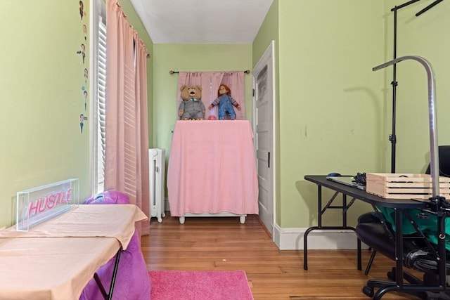 426 Moraine St, Brockton, MA 02301 - bedroom with radiator heating unit and wood finished floors