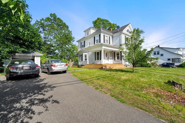 426 Moraine St, Brockton, MA 02301 - view of front of house featuring covered porch and a front lawn