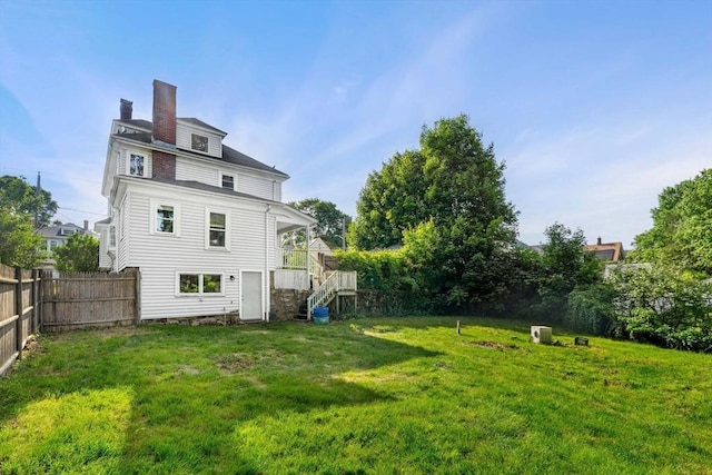 426 Moraine St, Brockton, MA 02301 - rear view of property featuring a chimney and stairway