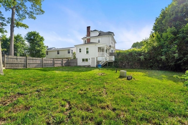 426 Moraine St, Brockton, MA 02301 - rear view of house with stairway and a chimney