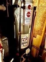 utility room with water heater
