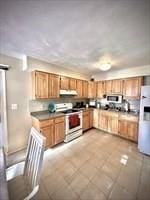 kitchen featuring white appliances and under cabinet range hood