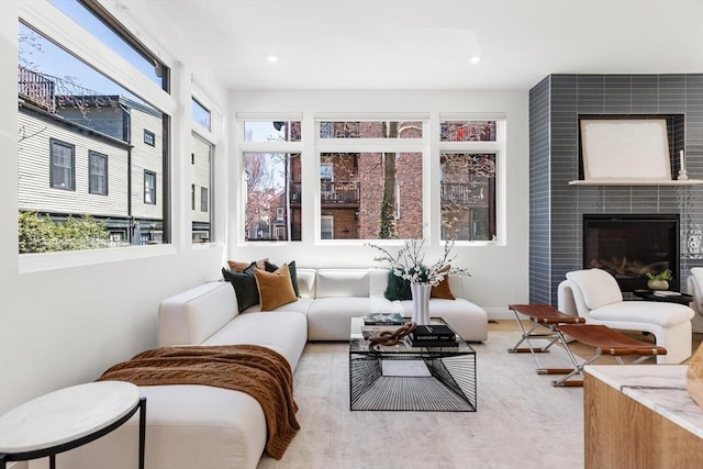 living room with a fireplace and recessed lighting