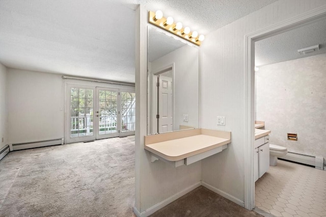 27 Fuller Pond Rd Unit 27, Middleton, MA 01949 - bathroom with toilet, a baseboard radiator, vanity, and a textured ceiling