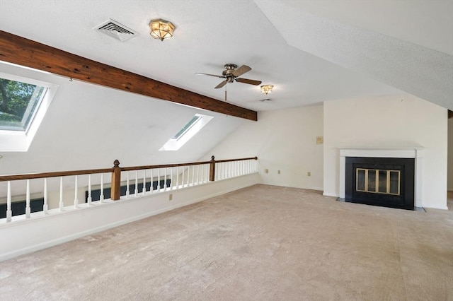 27 Fuller Pond Rd Unit 27, Middleton, MA 01949 - unfurnished living room with a skylight, carpet floors, and a fireplace with flush hearth