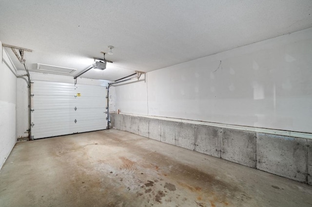 27 Fuller Pond Rd Unit 27, Middleton, MA 01949 - garage featuring a garage door opener