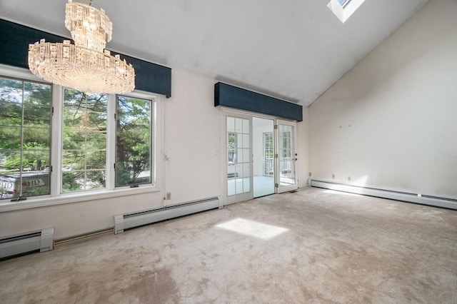 27 Fuller Pond Rd Unit 27, Middleton, MA 01949 - carpeted spare room featuring a chandelier, a baseboard heating unit, vaulted ceiling, and a skylight