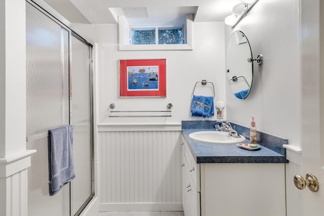 39 Fairway Pointe Rd Unit 39, Falmouth, MA 02536 - bathroom with vanity, a shower with door, and wainscoting