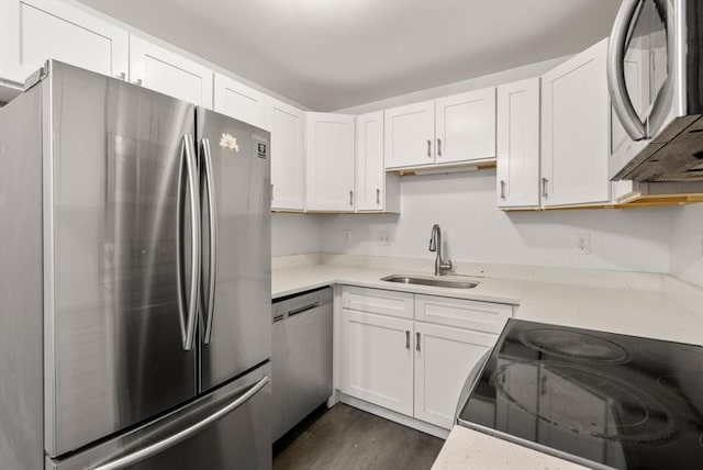 124 Addison St Unit 15, Chelsea, MA 02150 - kitchen featuring a sink, light countertops, white cabinets, and stainless steel appliances