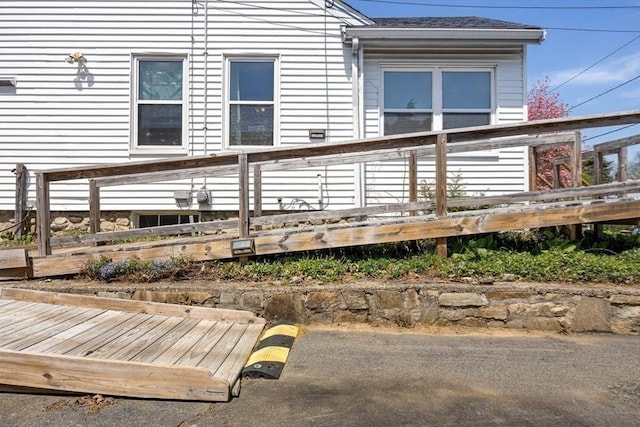back of house with a wooden deck