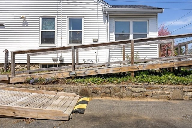 rear view of house with a wooden deck