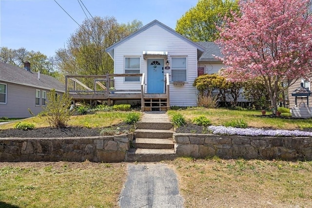 bungalow featuring a deck