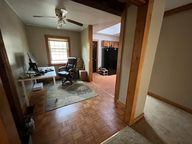 office space featuring light parquet flooring, ornamental molding, and ceiling fan