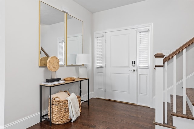 foyer with dark hardwood / wood-style floors