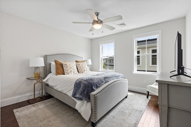 bedroom with dark wood-type flooring and ceiling fan